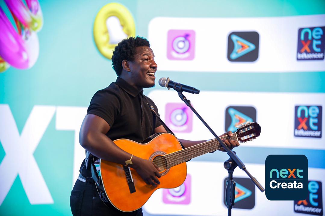 Popular singer, Kenneth Mugabi, performing for guests during the launch