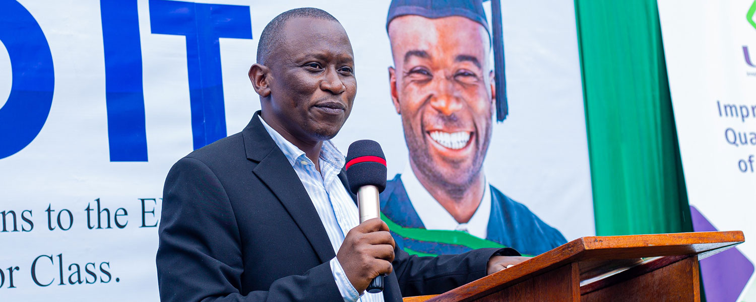 Dr. Francis Mwesigye, Director of Economic Research & Knowledge Management at Uganda Development Bank, speaking at the ceremony in Mbale